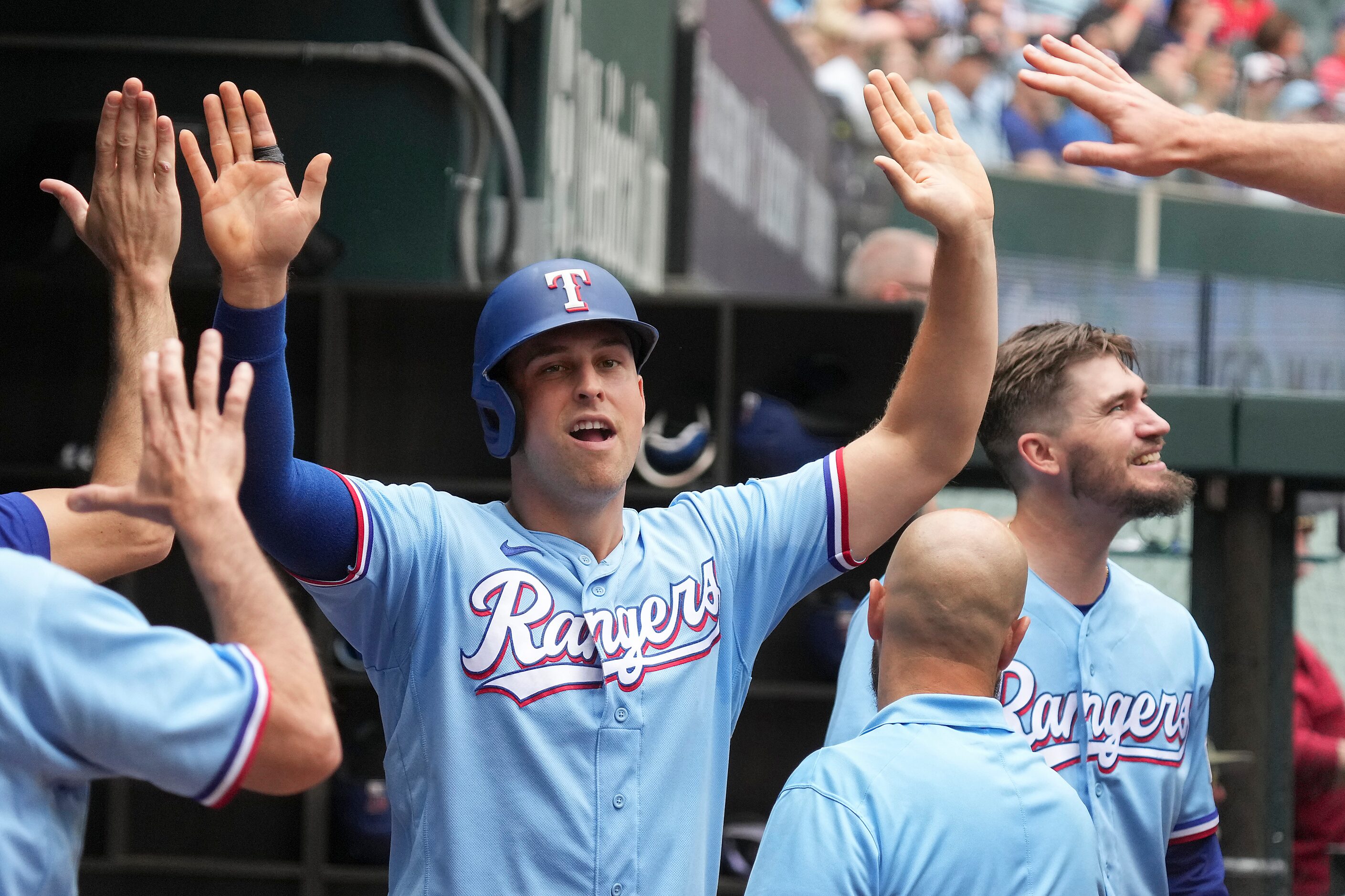 Texas Rangers first baseman Nathaniel Lowe celebrates after scoring during the fifth inning...