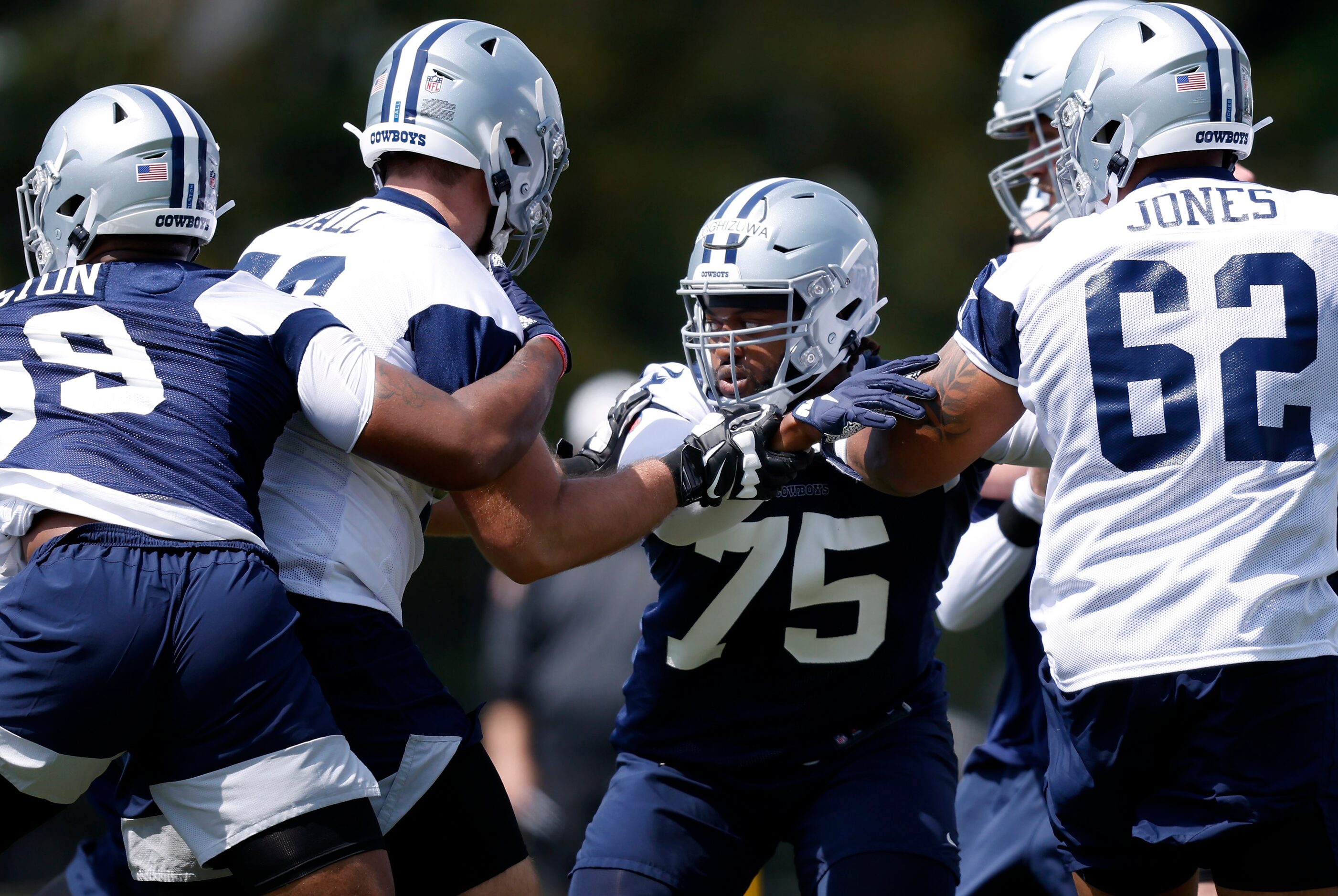 Dallas Cowboys rookie defensive tackle Osa Odighizuwa (75) goes up against rookie tackle...