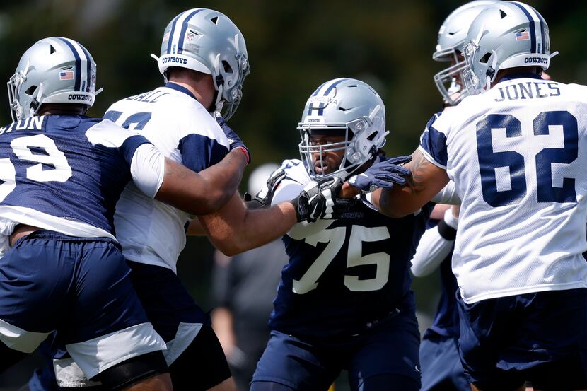 Dallas Cowboys rookie defensive tackle Osa Odighizuwa (75) goes up against rookie tackle...