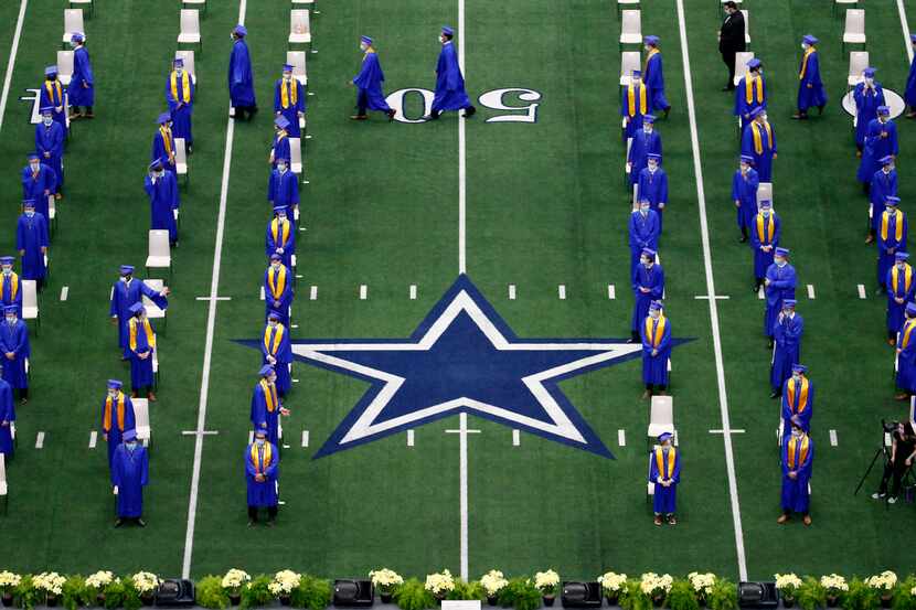 Graduates from the Jesuit College Preparatory School of Dallas file into their...