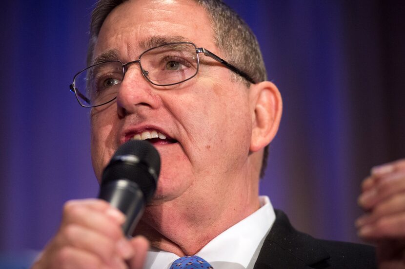 U.S. Rep. Michael Burgess, R-Pilot Point, speaks during the live auction at the Lincoln...