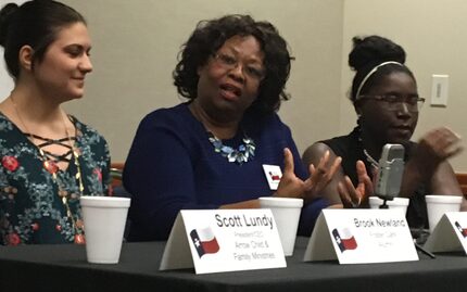 Arlington foster parent Wilma David May (center) spoke at the Texas Capitol on Wednesday....