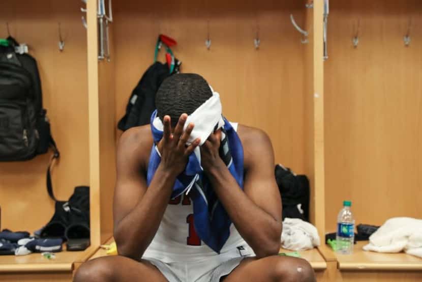 SMU guard Shake Milton sits in the locker room after peaking to media following the team's...