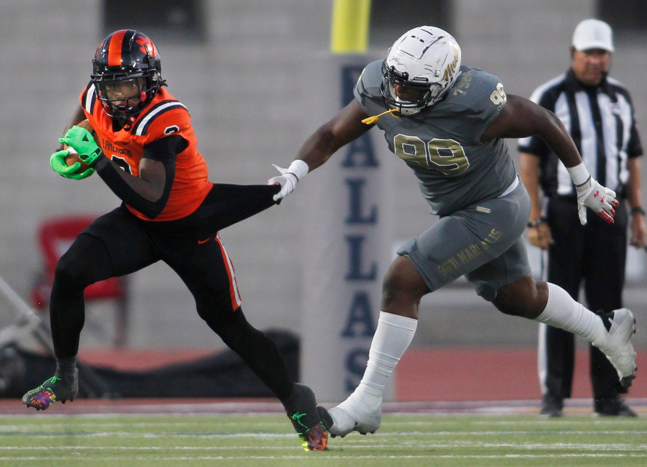 Lancaster running back Kewan Lacy (2) is stopped after a short gain by South Oak Cliff...