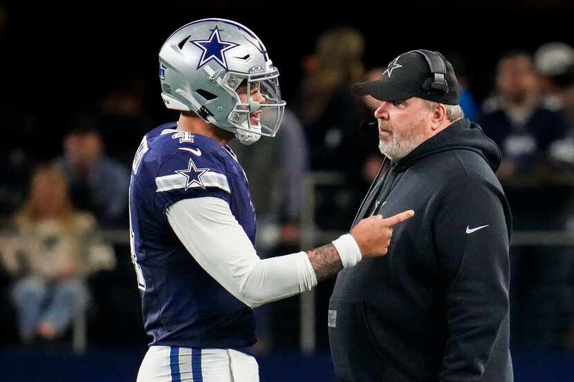 Dallas Cowboys quarterback Dak Prescott (4) talks with head coach Mike McCarthy during the...
