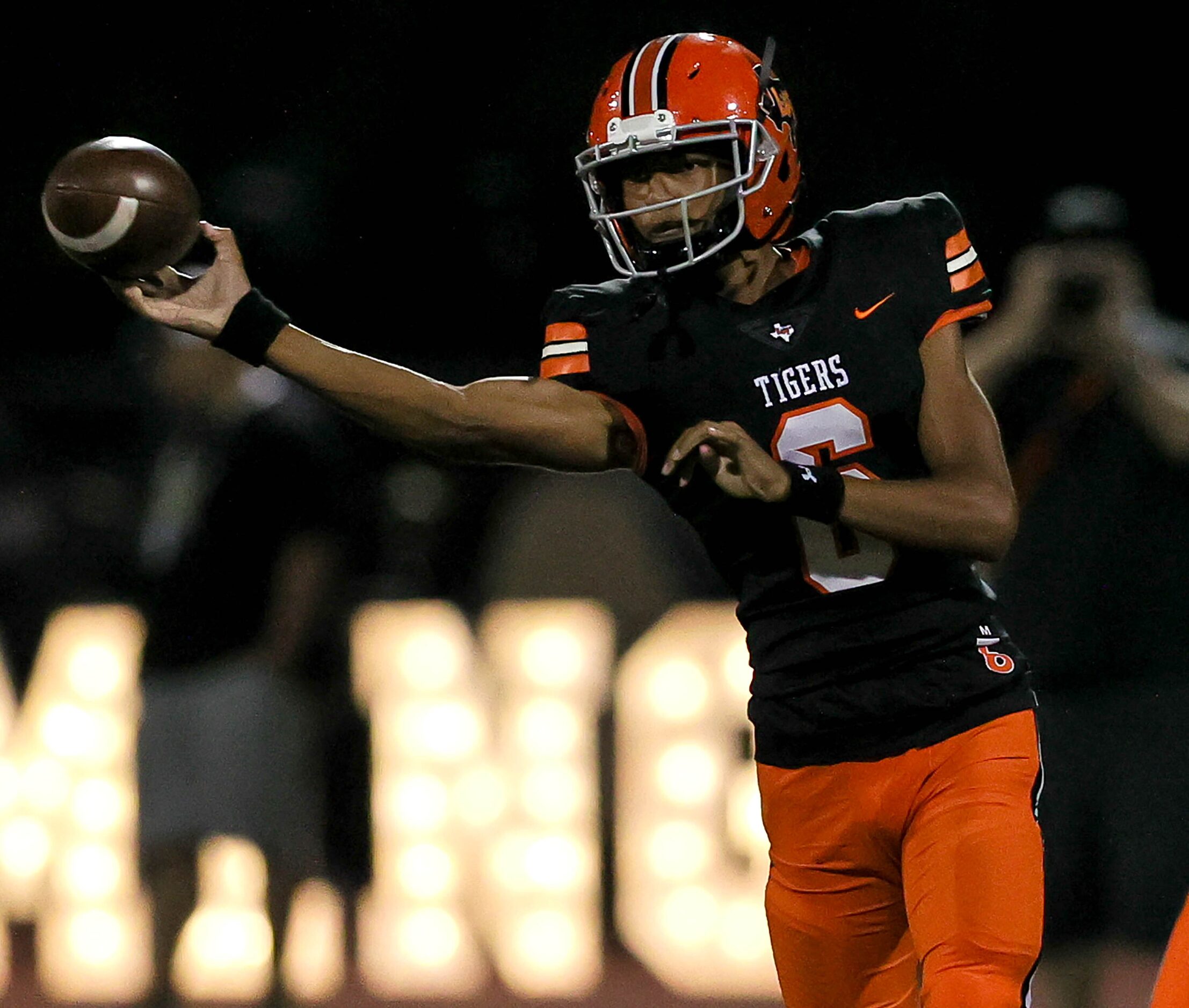 Lancaster quarterback Carter Jones attempts a pass against Forney during the first half of a...