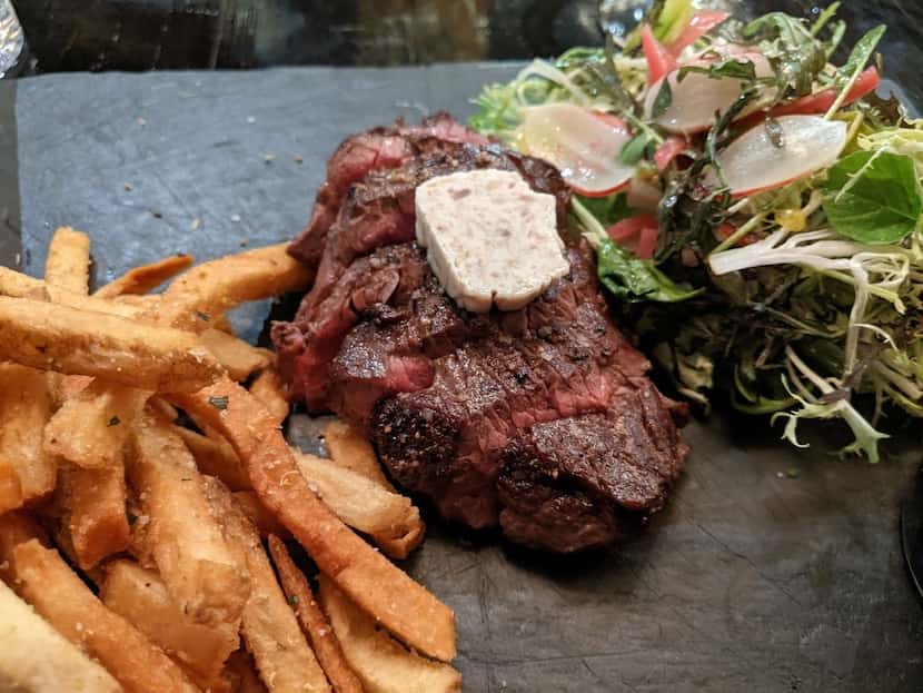 Steak frites at the Mitchell in downtown Dallas, topped with a pat of bone marrow butter.