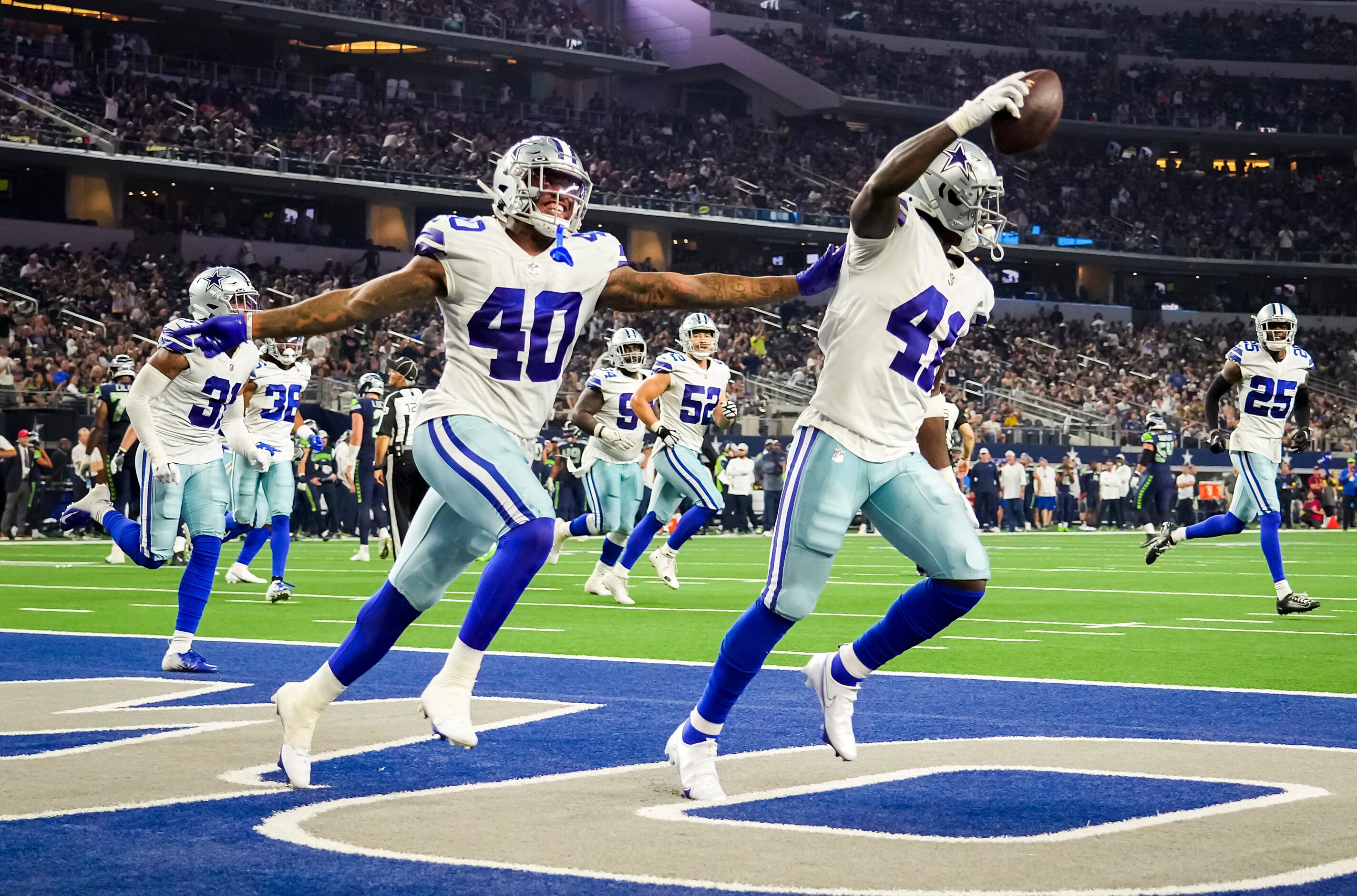 Dallas Cowboys safety Markquese Bell (41) celebrates with safety Juanyeh Thomas (40) after...