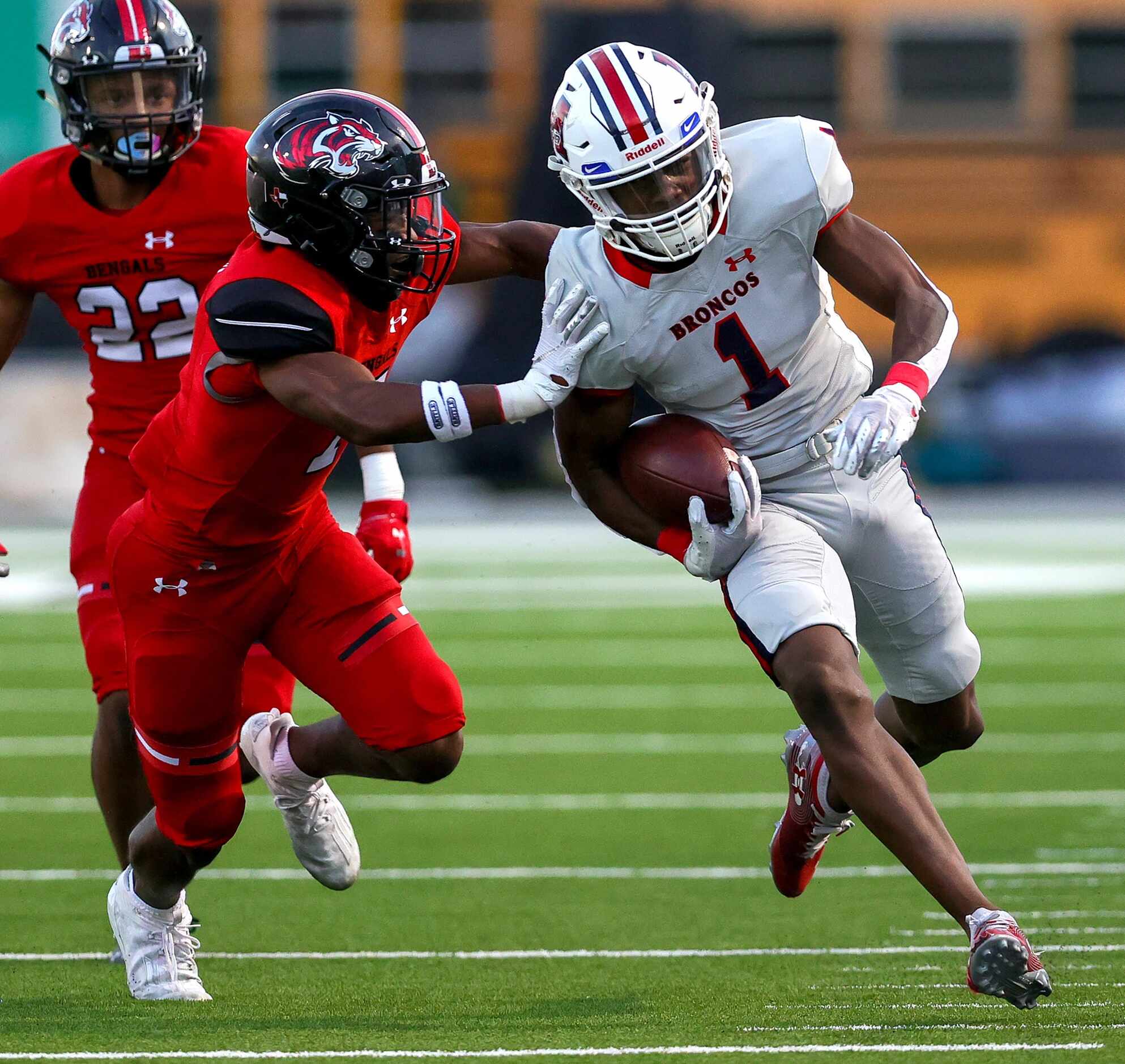 McKinney Boyd wide receiver Tre' Collins (1) gets pushed out of bounds by Denton Braswell...