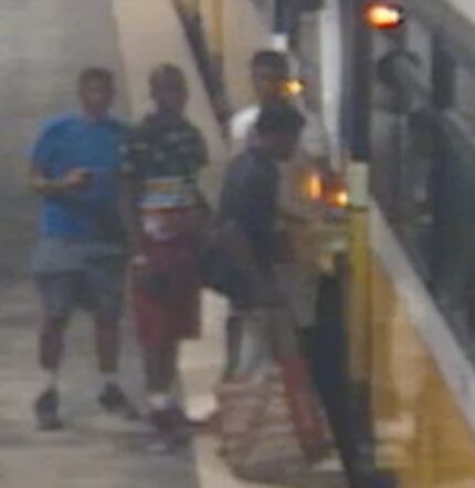 A photo believed to show the four suspects boarding a DART train shortly after the crime.