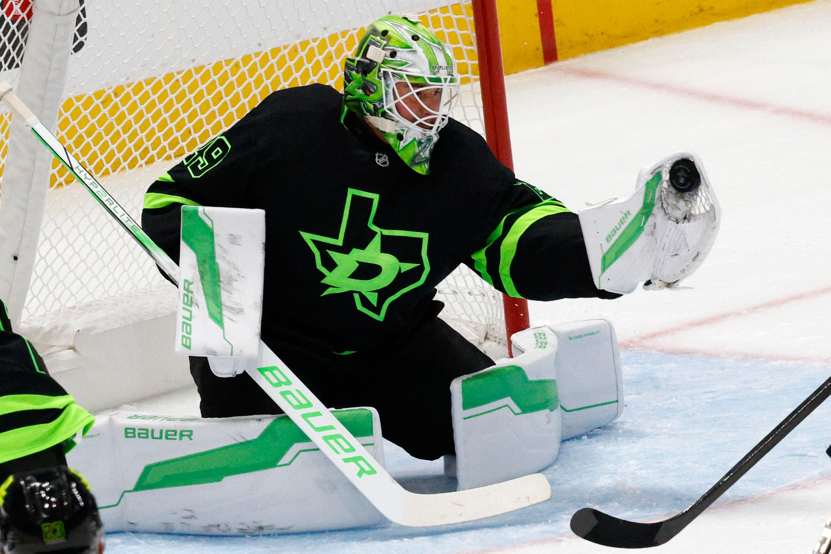 Dallas Stars goaltender Jake Oettinger (29) makes a save against Colorado Avalanche during...