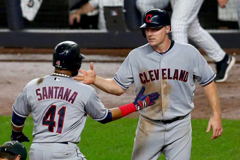 NEW YORK, NY - OCTOBER 09:  Carlos Santana #41 of the Cleveland Indians celebrates after...