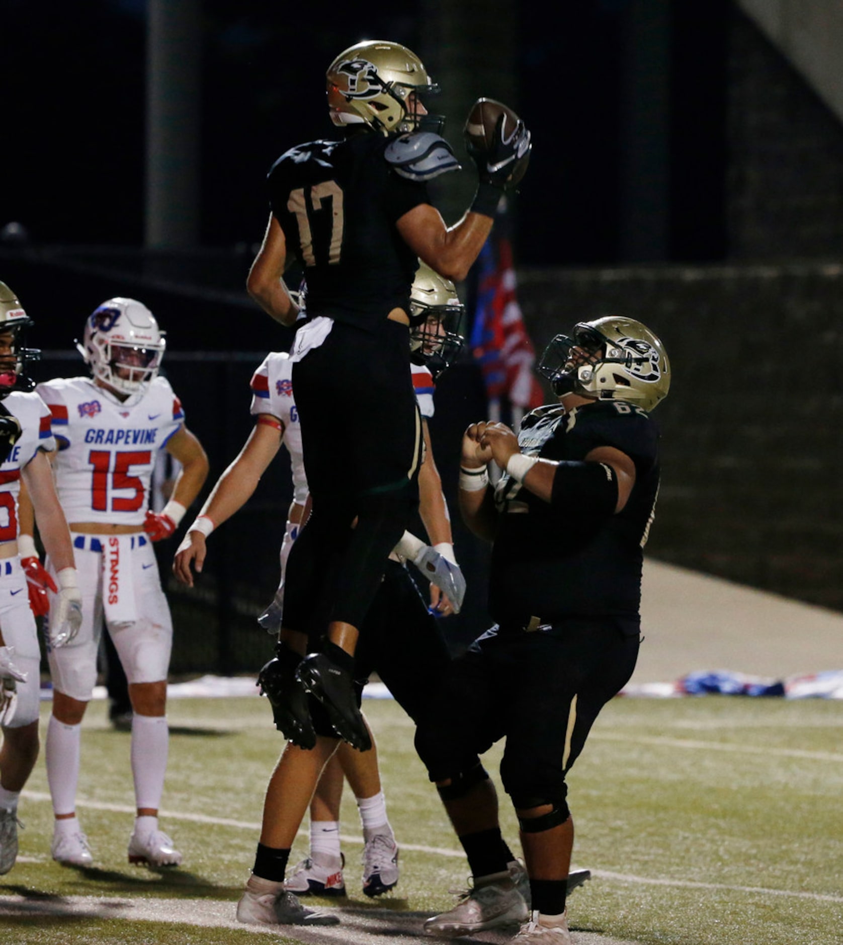 Birdville's Cooper McCasland (17) celebrates his touchdown reception with offensive lineman...