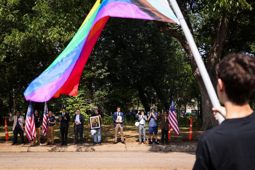 A group of protesters set up across Maple Avenue holding crosses and Bibles as...