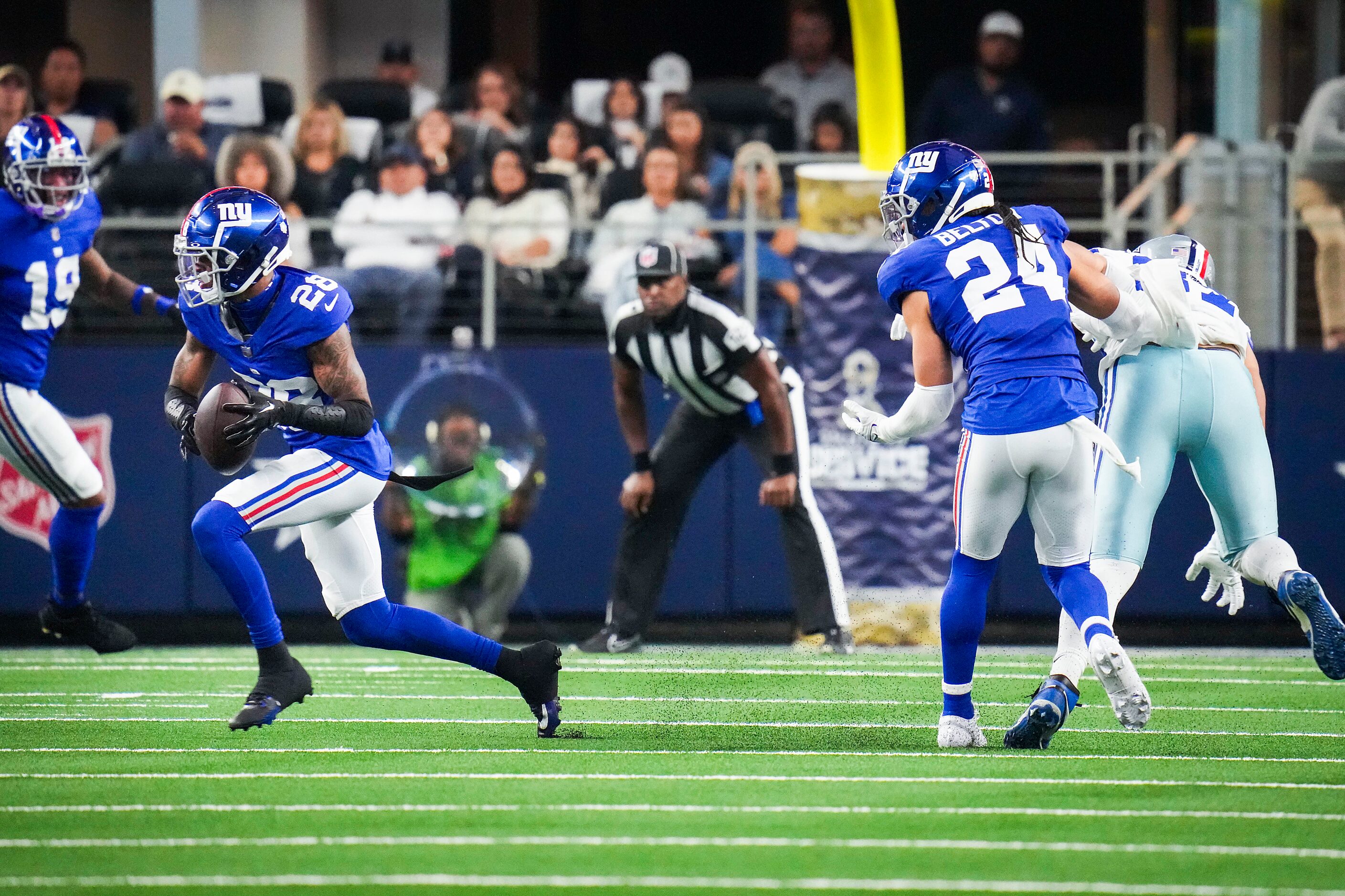 New York Giants cornerback Cor'Dale Flott (28) intercepts a pass intended for Dallas Cowboys...