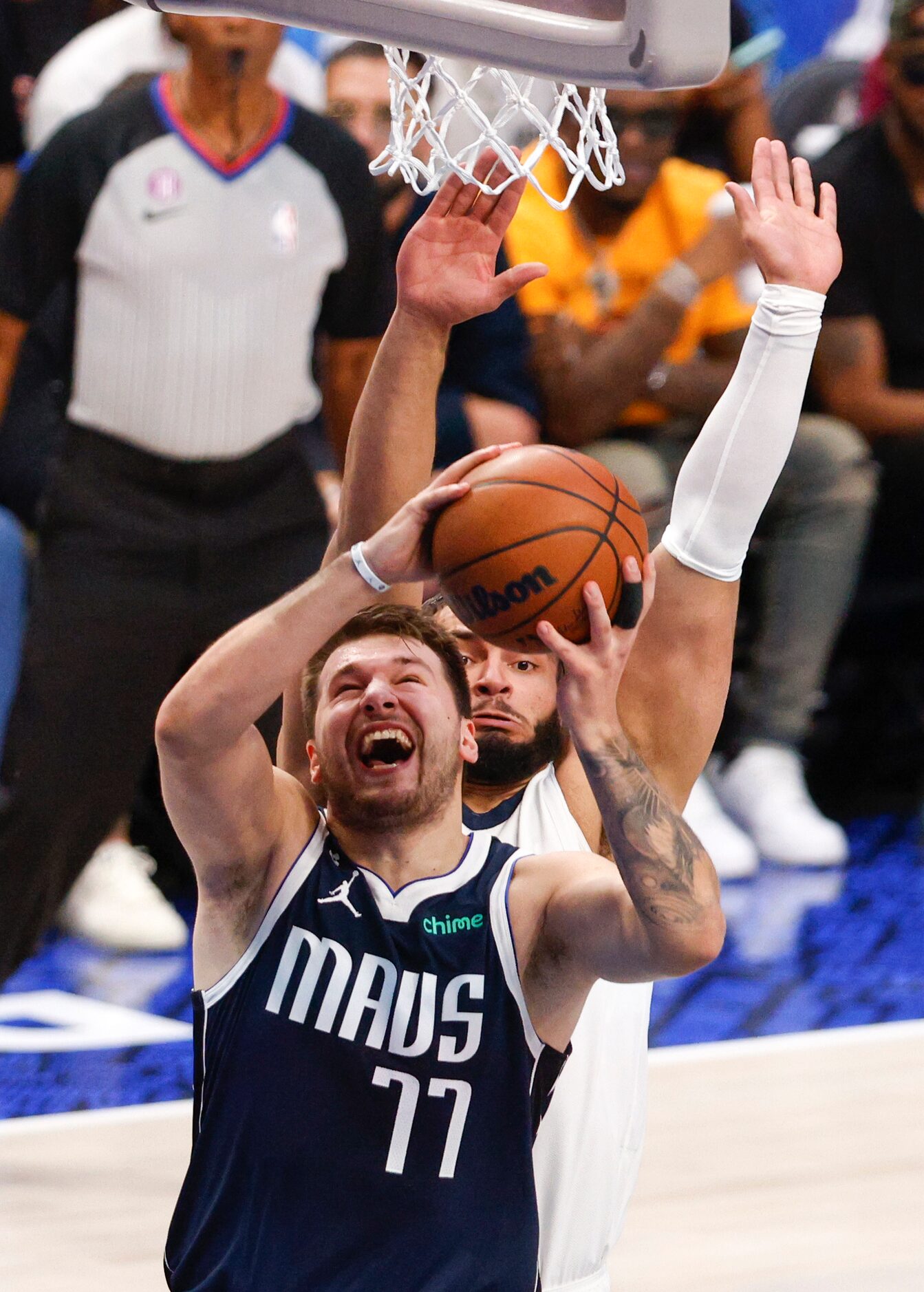 Dallas Mavericks guard Luka Doncic (77) attempts a layup against Memphis Grizzlies guard...