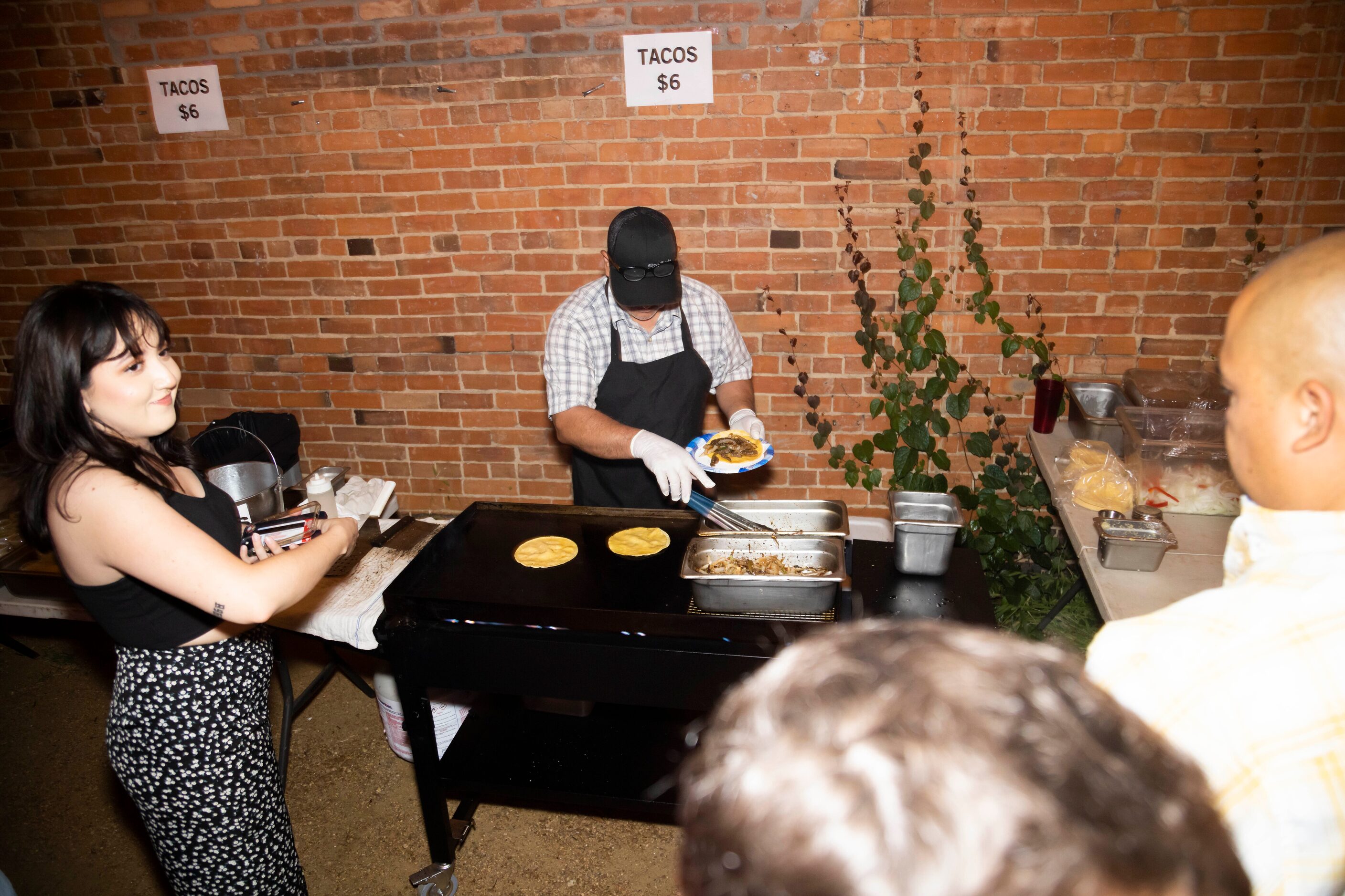 Jaime Reyes cooks up tacos during the Cumbia Dance Party event hosted at Cheapsteaks in the...