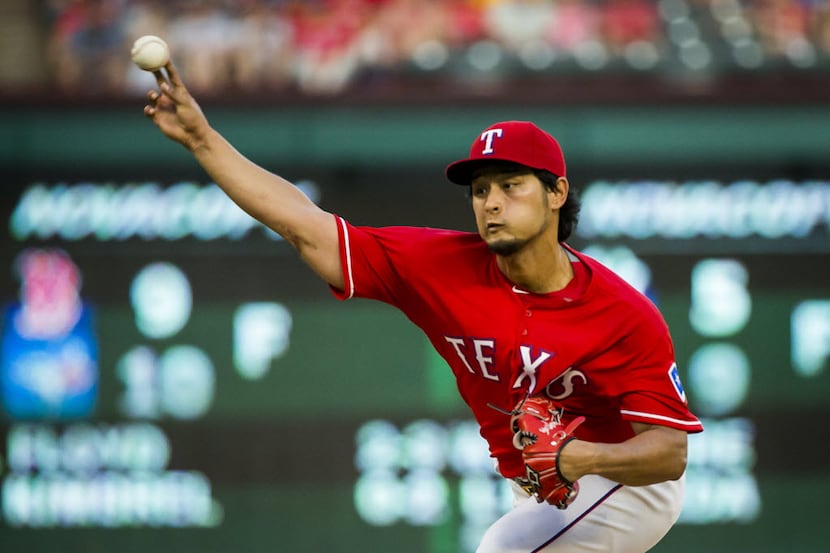 Texas Rangers starting pitcher Yu Darvish pitches during the fifth inning against the...