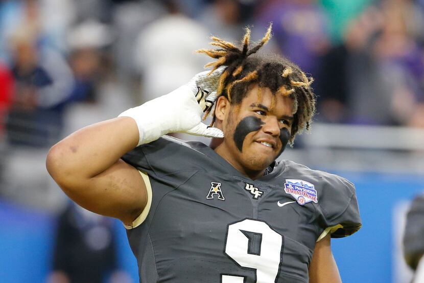 FILE - UCF defensive lineman Trysten Hill (9) during the Fiesta Bowl NCAA college football...