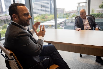 From left: Vikram Kohli, CBRE’s chief operating officer, and CEO Bob Sulentic sit in the...