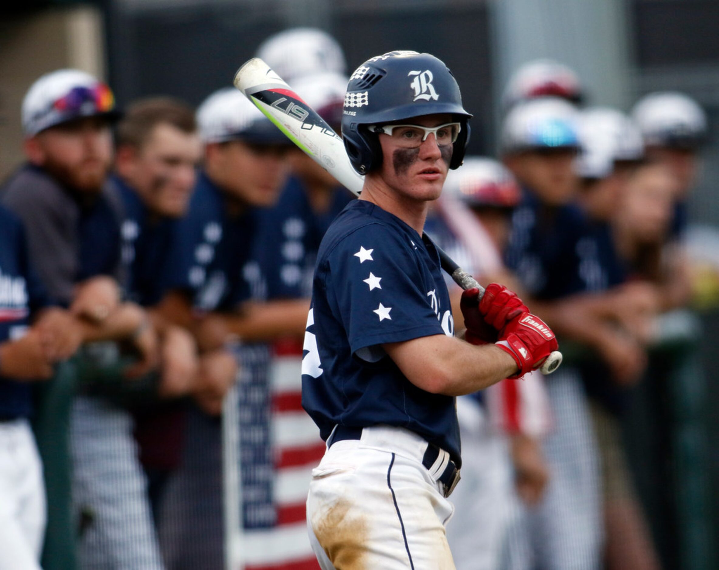 Richland outfielder Tucker Paris (4) watches with intent as a teammate bats in the 4th...