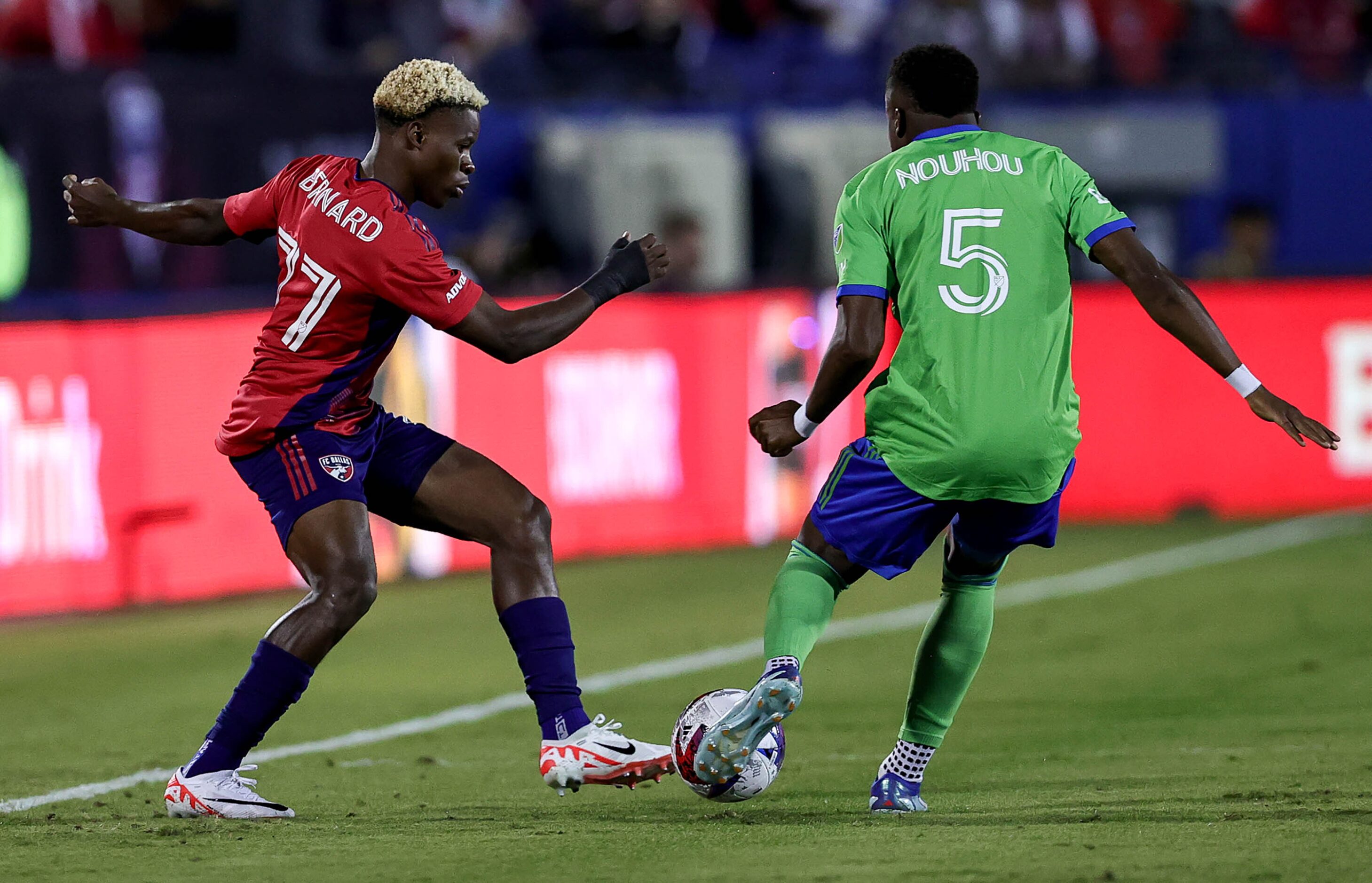 FC Dallas attacker Bernard Kamungo (77) goes for a loose ball against Seattle defender...