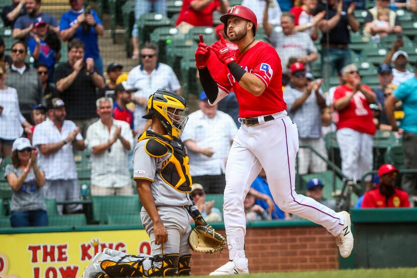 Texas Rangers left fielder Joey Gallo (13) crosses home plate after hitting his 99th career...