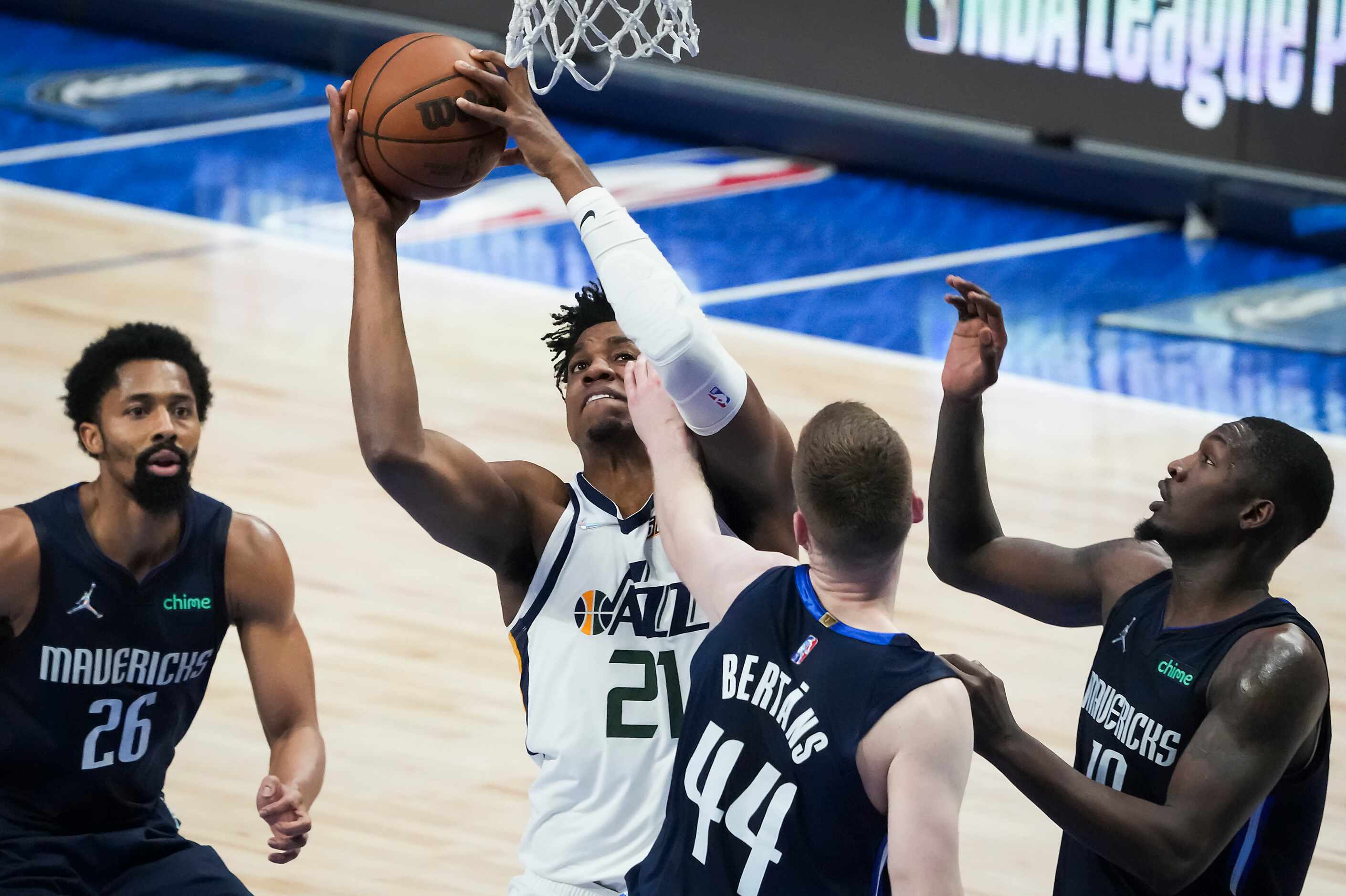 Utah Jazz center Hassan Whiteside (21) grabs a rebound away from Dallas Mavericks guard...