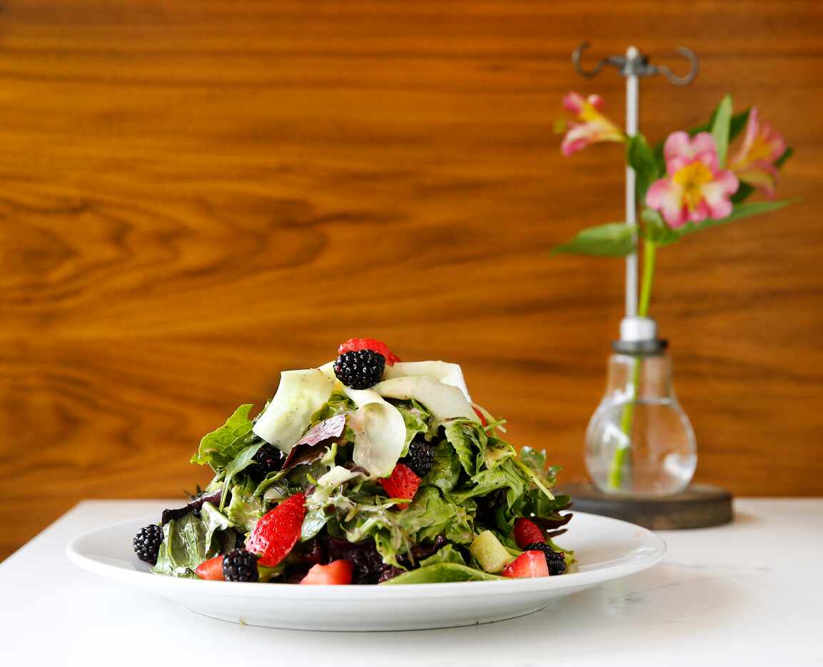 The Bella Berry Salad according to the menu is made with vibrant spring mix, nutty arugula &...