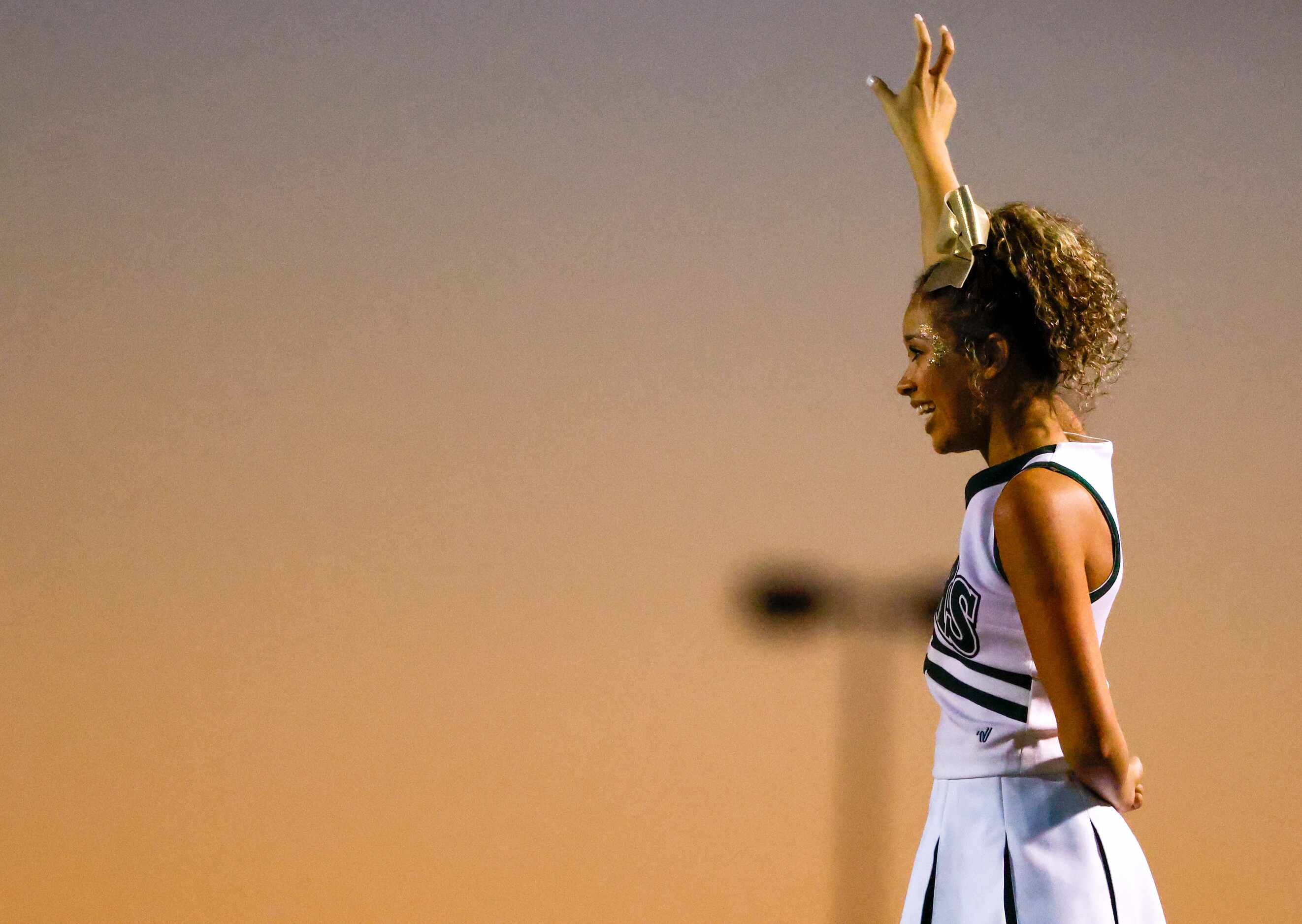 Birdville cheerleaders lead a chant for a kick during a game against Mansfield Timberview at...