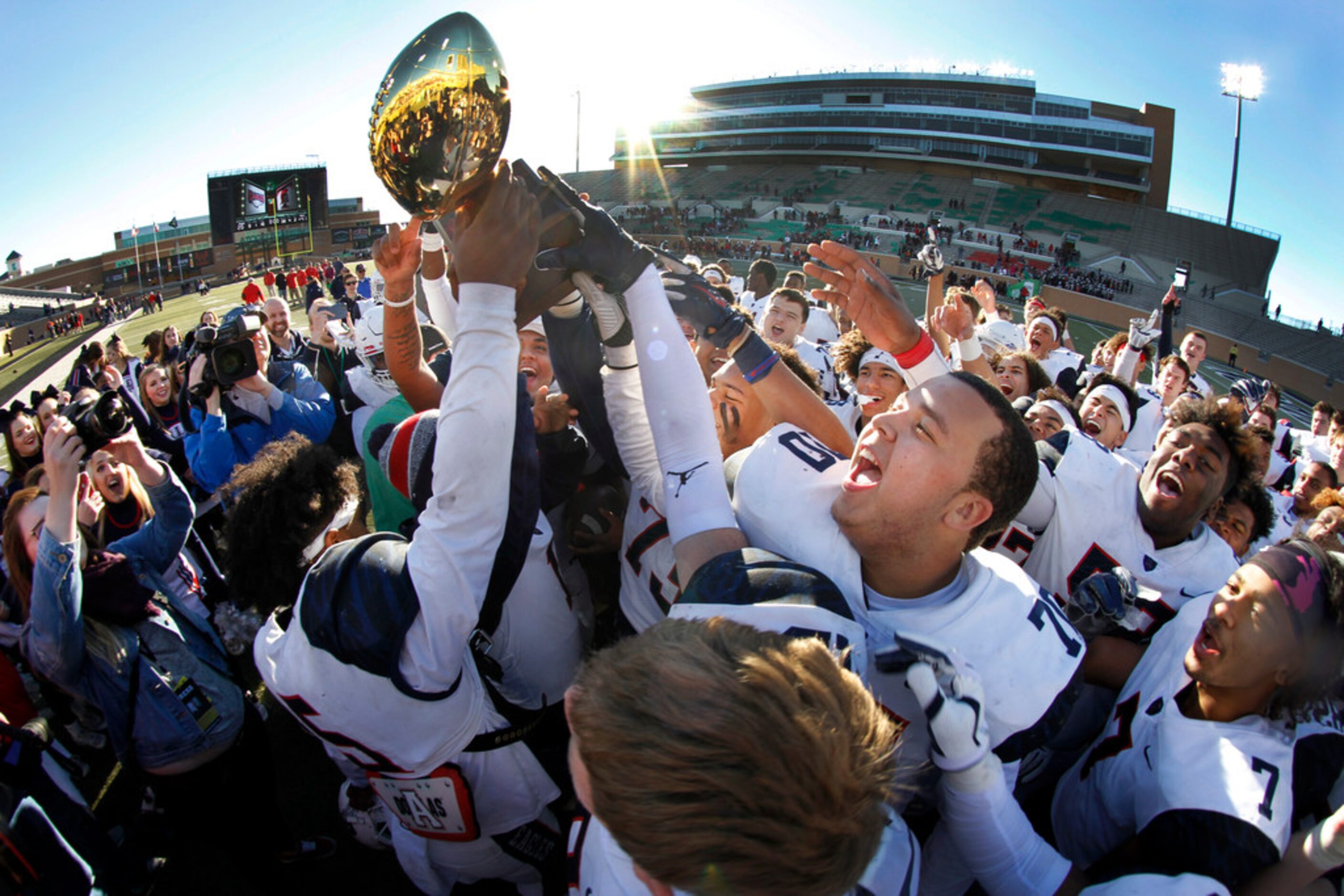 Euphoria filled the air as members of the Allen Eagles celebrate their 41-20 victory over...