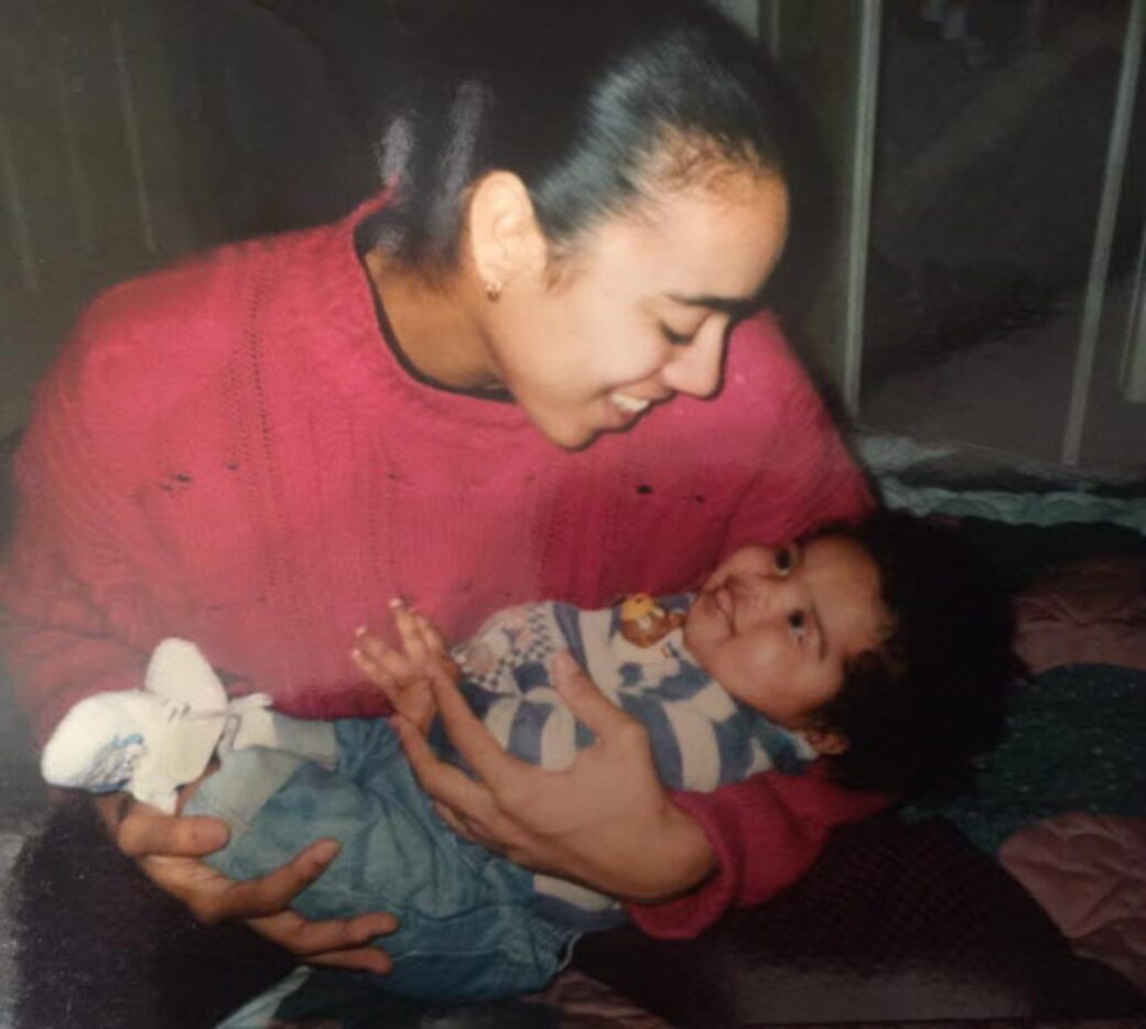 Dawn Elliott holds baby Ezekiel. Dawn, the mother of the Cowboys running back, was a track...