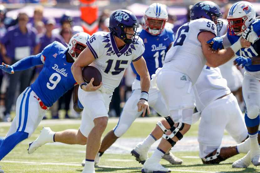 TCU quarterback Max Duggan (15) runs the ball as his pursued by SMU defensive end Nelson...