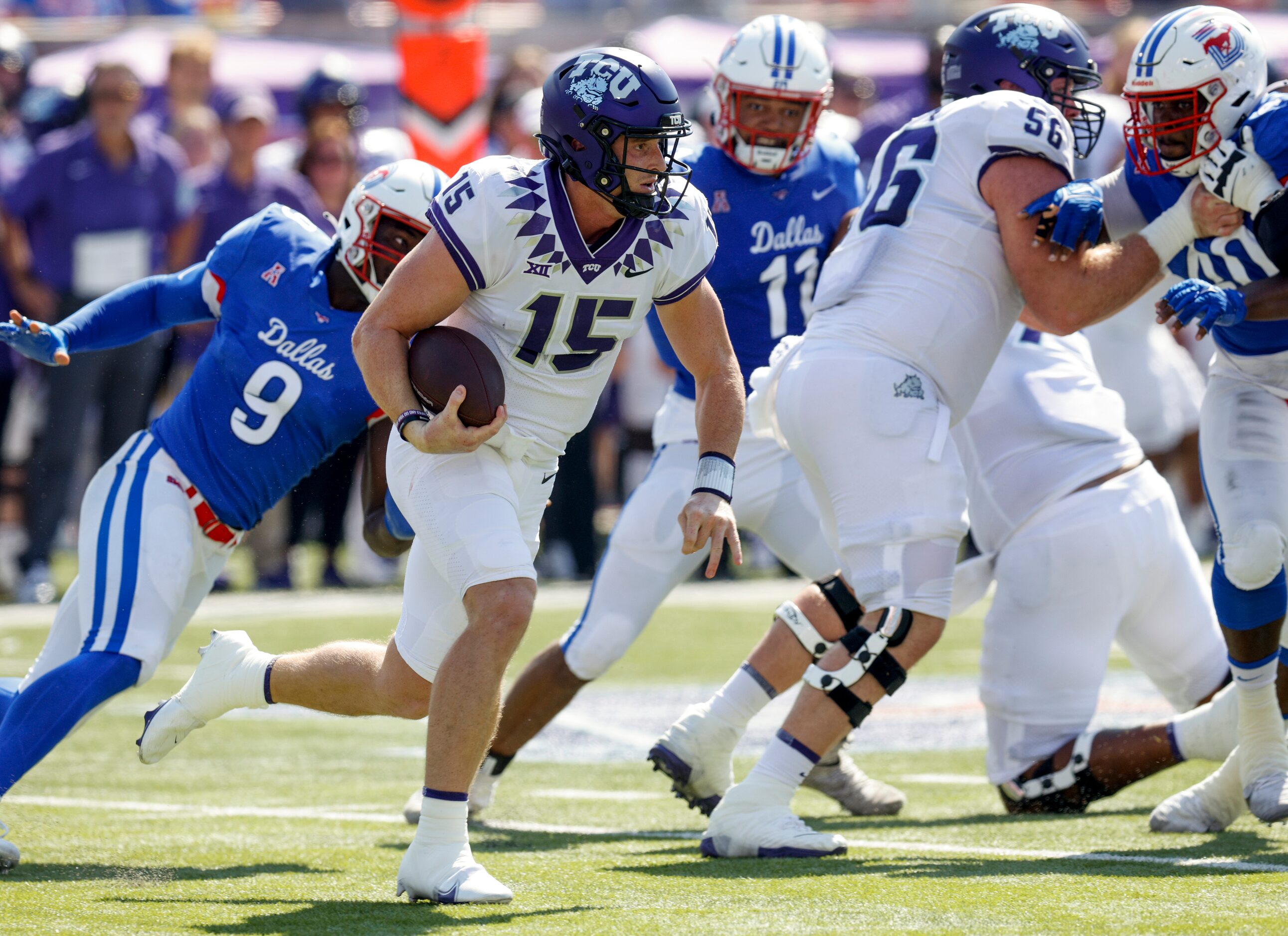 TCU quarterback Max Duggan (15) runs the ball as his pursued by SMU defensive end Nelson...