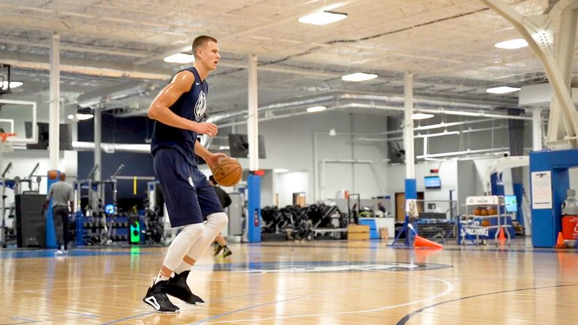 Dallas Mavericks power forward Kristaps Porzingis shoots baskets during the first mandatory...