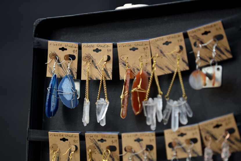 
Handcrafted earrings by Ribelle Studio are on display at Urban Flea. 
