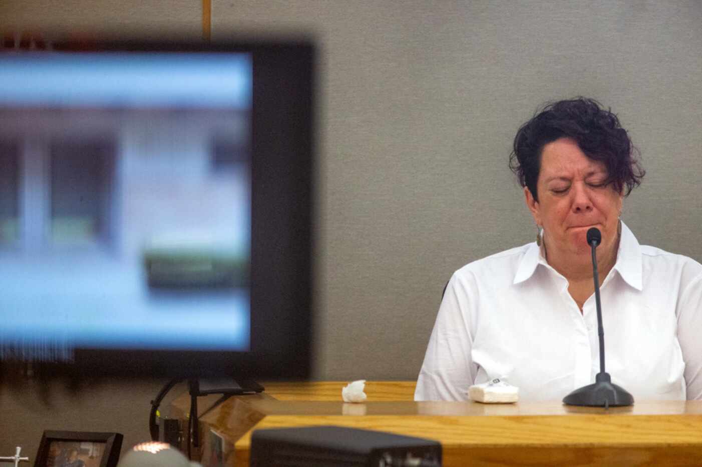 Amy Bascone Autrey pauses to collect herself during her testimony Monday morning.