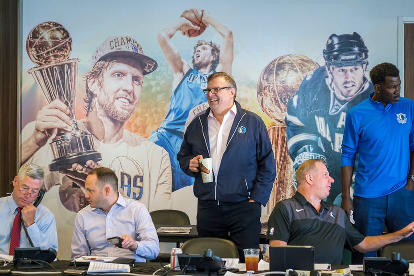 Dallas Mavericks president Donnie Nelson (center) in the draft room at American Airlines...