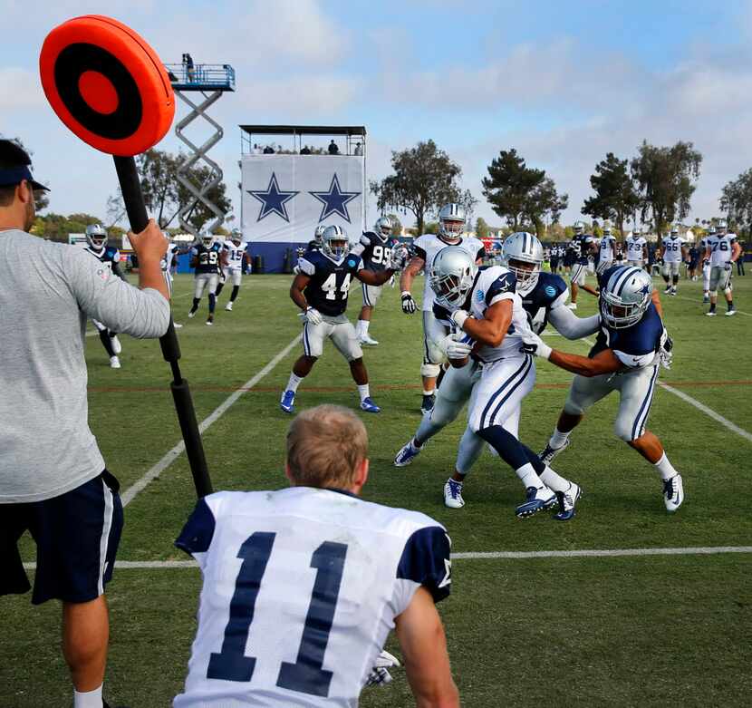A play comes out of bounds in front of Dallas Cowboys wide receiver Cole Beasley (11) during...