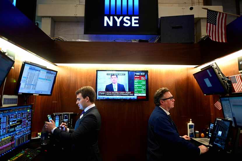 Traders work during the closing bell at the New York Stock Exchange on Wednesday.