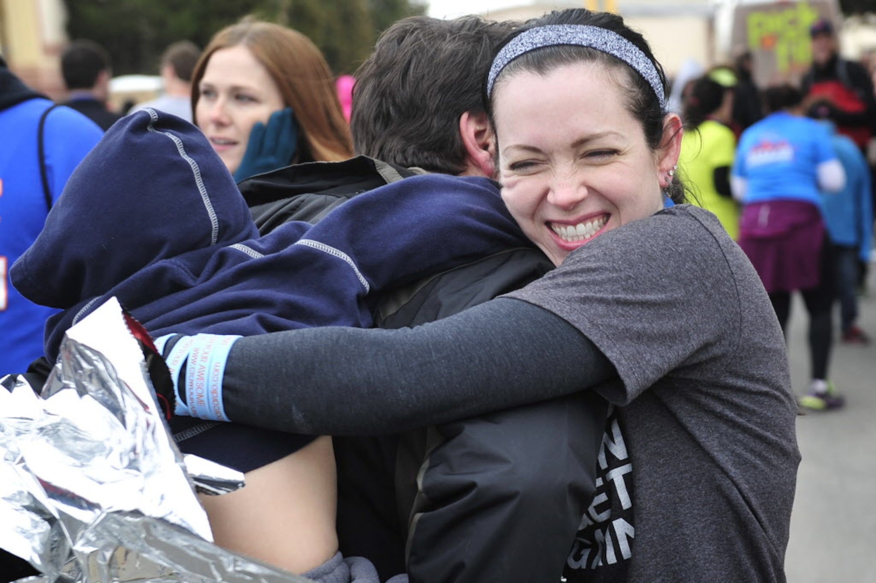 Karen Soltero hugs her friend Molly's Husband, Ben Setnick as they meet her after she...