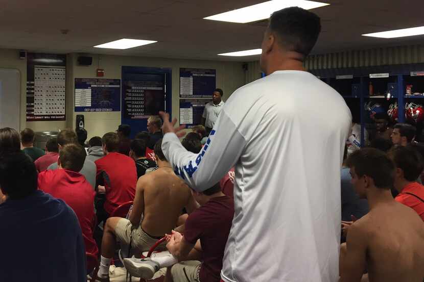 Head coach Randy Jackson talks to the Grapevine High School football team about recently...