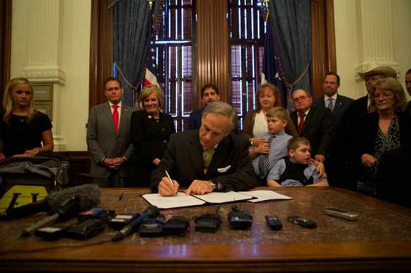  Gov. Greg Abbott signs a bill to allow cannabis oil for some medical treatments but says he...