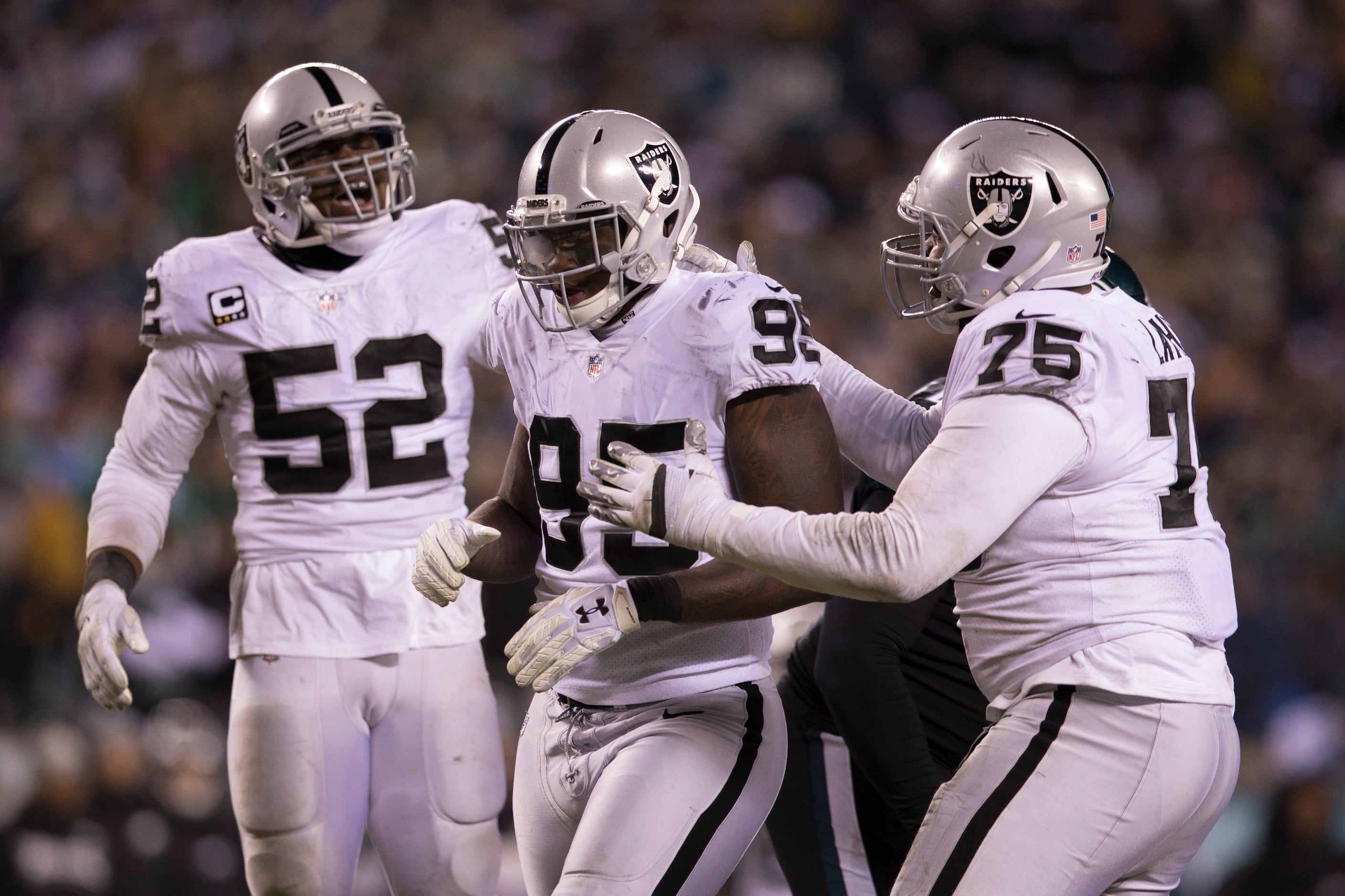 Oakland Raiders defensive end Khalil Mack (52) battles through the