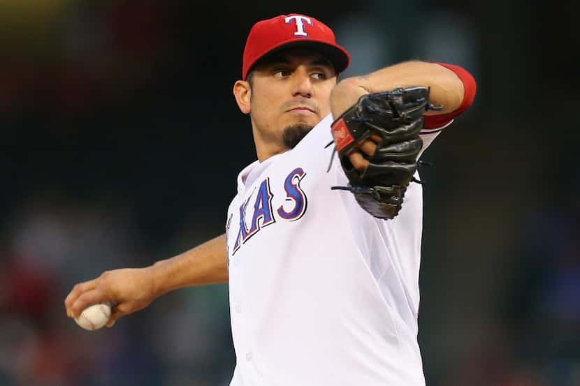 ARLINGTON, TX - SEPTEMBER 26:  Matt Garza #22 of the Texas Rangers throws against the Los...