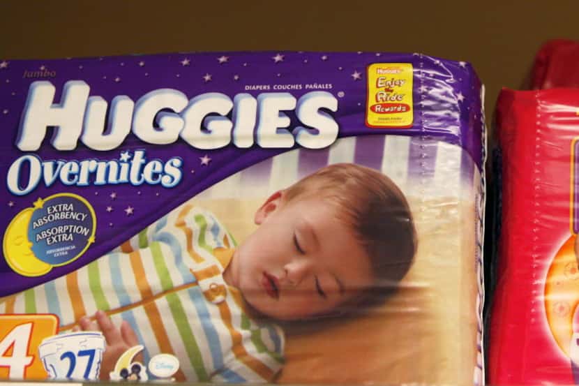 Packages of Huggies and Pull-Ups, both Kimberly-Clark brands, are displayed at a store in...