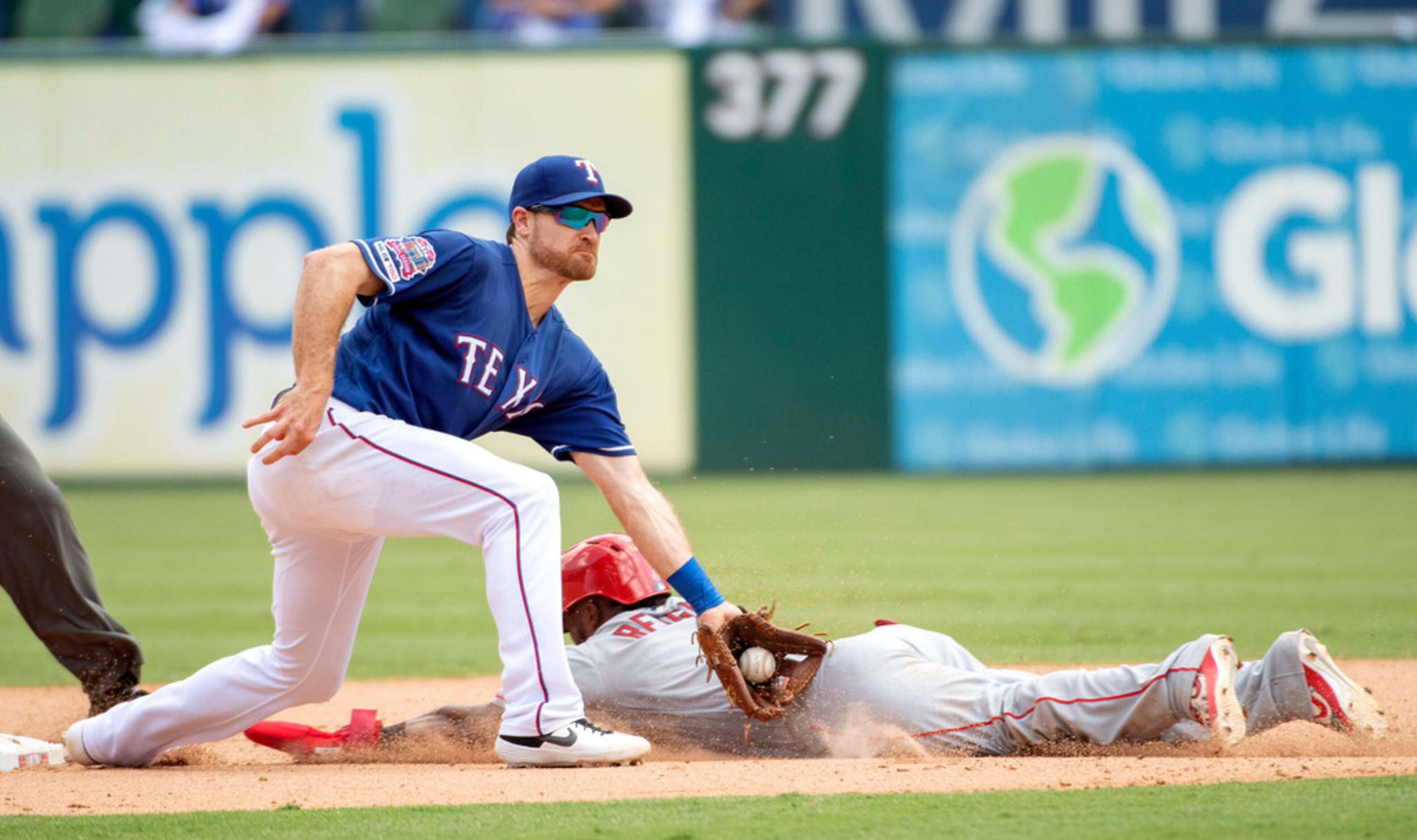 Texas Rangers shortstop Logan Forsythe receives the throw ahead of Los Angeles Angels'...