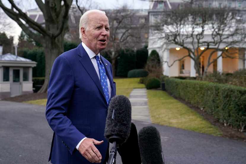 President Joe Biden speaks to reporters as he returns to the White House in Washington,...