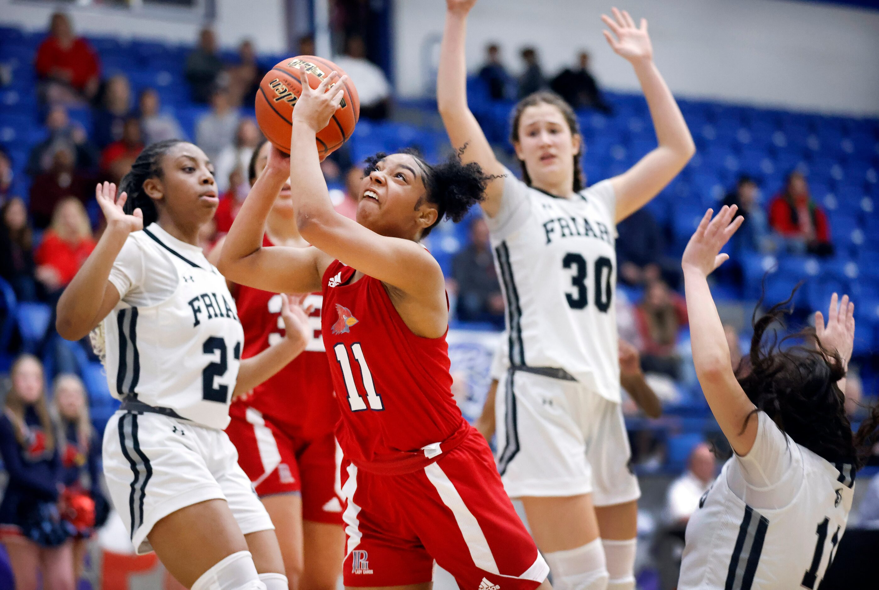 John Paul II guard Lydia Cooke-Wiggins (11) drives the lane for a layup against the Bishop...