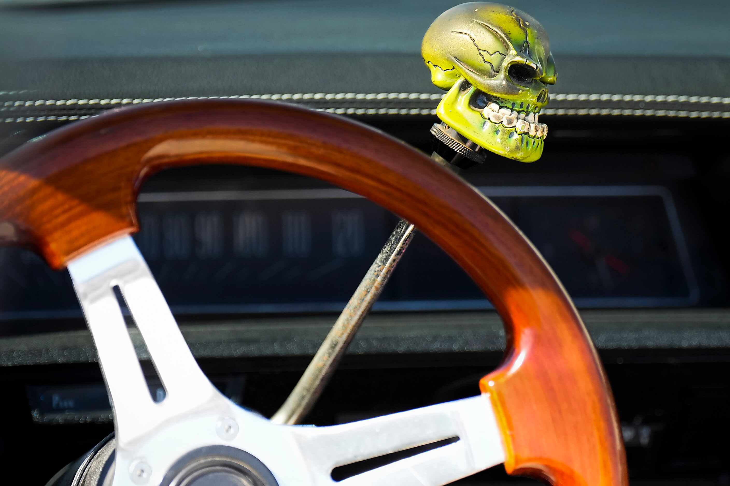 A detail of the shifter in a car on display from the Dallas Lowriders car club during the...